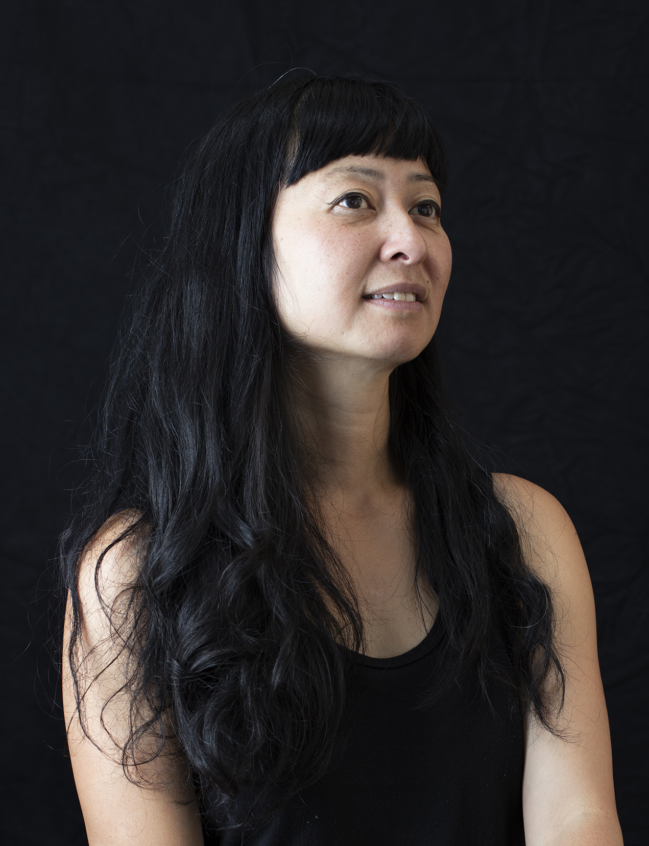 Stephanie Syjuco portrait smiling.