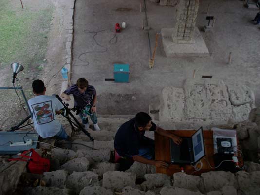 three people and scanning equipment on the Stairway