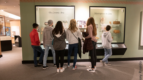 self-guided group in Hall of the North American Indian.