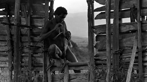 Siloba working on something in the entryway to a sili.