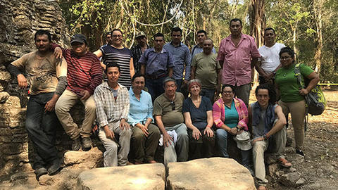 group shot of coworkers at Maya ruins
