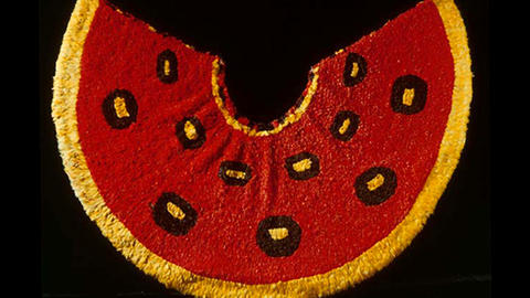Red and yellow feathered cape from Hawaii