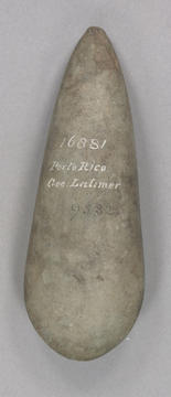 Beige colored stone tool in a teardrop shape