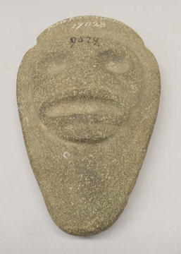Carved stone artifact with face