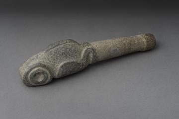 Grey stone tool with carving