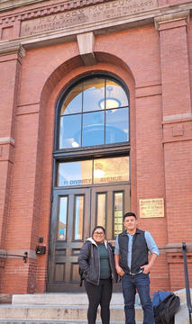 Two people in front of Peabody Museum