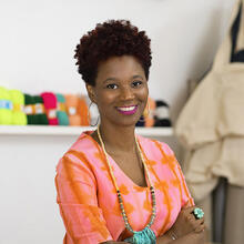 A portrait of Joana Choumali. She smiles at the lens.