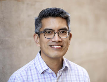 smiling portrait of Jason Reblando.