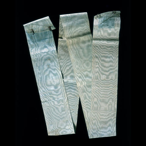 folded blue sash.