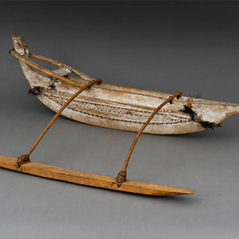 model of canoe with outrigger.