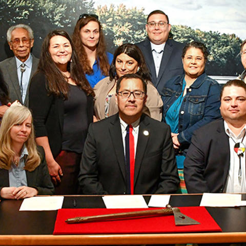 Delegation of Ponca tribal members and elders seated with Peabody staff during signatory ceremony