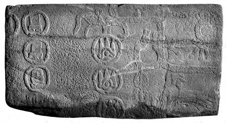 Basalt bas-relief carving with glyphs