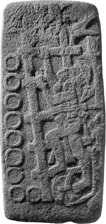 Basalt bas-relief carving with figure and circular numbers