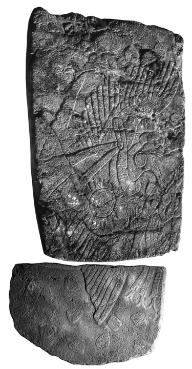 Basalt bas-relief carving with figure and vulture