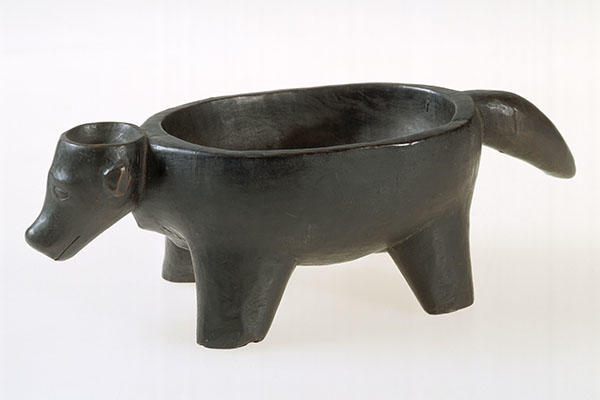 carved wooden dish shaped like an animal.