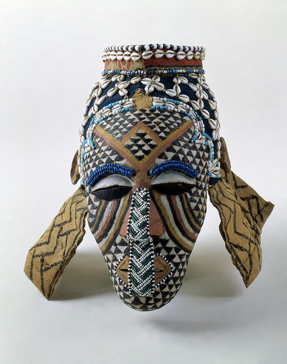 Face mask with cloth hood Bushoong carver and tailor, Kuba Group, Democratic Republic of Congo. Gift of Mrs. George Howe, A. C. Coolidge, and Oric Bates, 17-41-50/B1908
