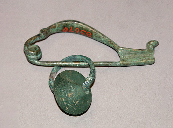 Ornamental bronze fibula (brooch or pin) excavated from village near Belluno, Italy. Bequest of Dana Estes, 11-50-40/83670
