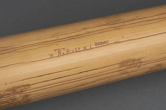 detail headrest with name carving.