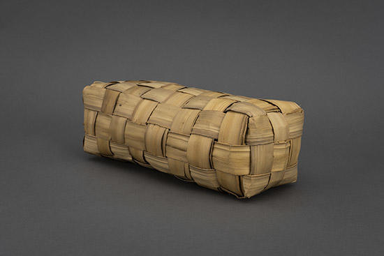woven pillow of pandanus leaves.