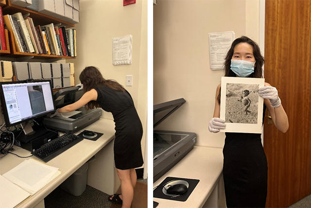 Women standing in office scanning and woman holding a photograph