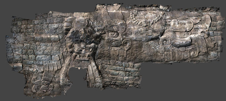wings and chest of a mythical bird in the modeled stucco