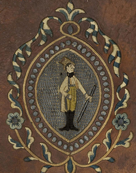 Anquera embroidered man with stick