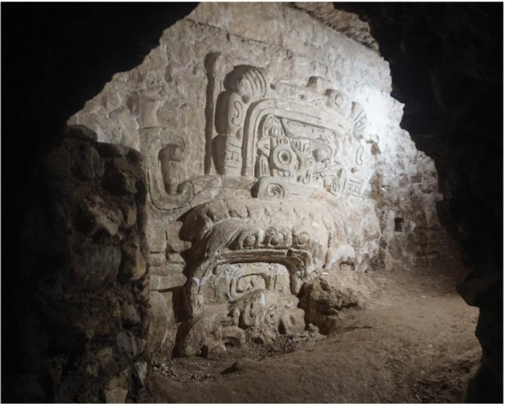white stucco relief in earthen tunnel