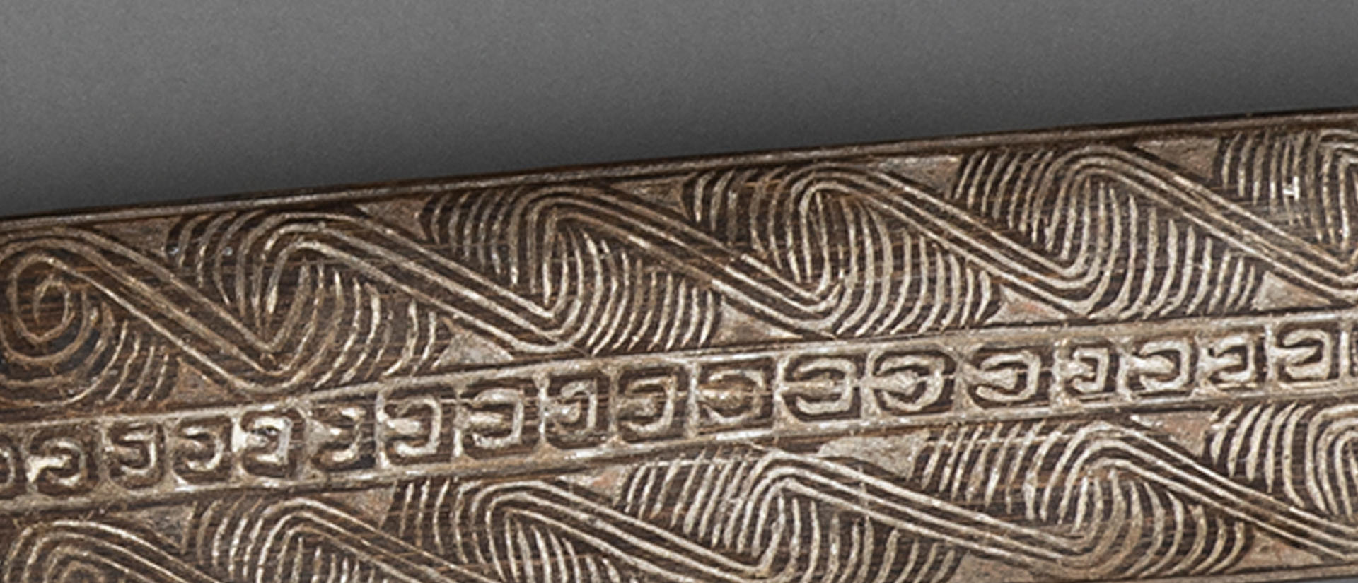 close view of carvings on club.