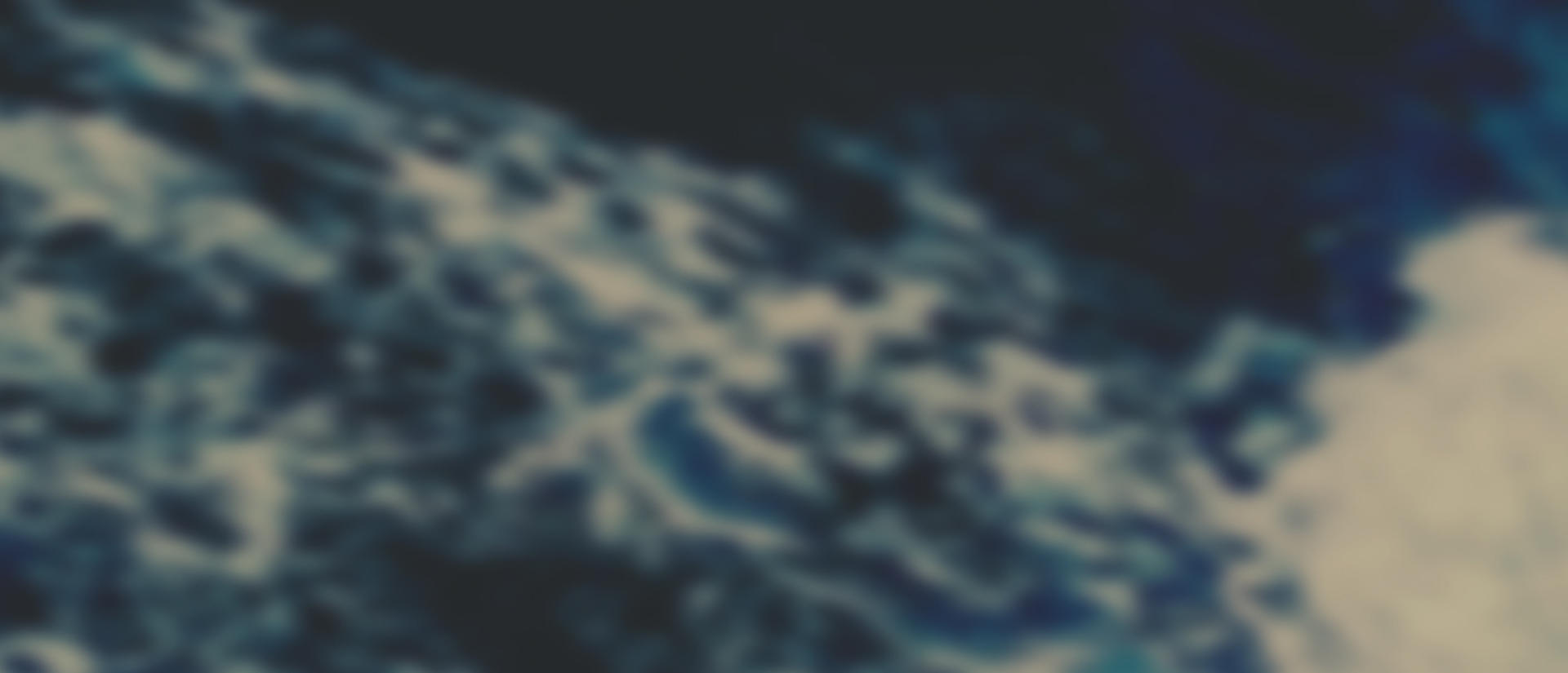 A blurred blue wave.